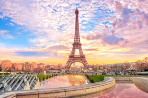 Eiffel Tower at sunset in Paris, France. Romantic travel background