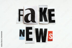 FAKE NEWS word arranged from cut letters from the press.