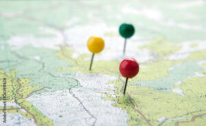 topographic map with colored needles pushpins close up
