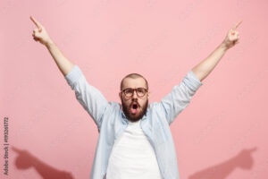 Winning success man happy ecstatic celebrating being a winner. Dynamic energetic image of male model