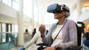 A Man in a Wheelchair Using a Virtual Reality Headset