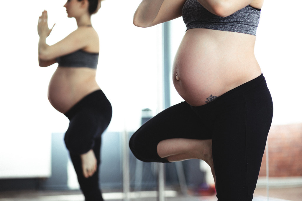 pregnant women in yoga pose