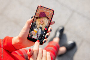 Woman viewing social media content on mobile phone