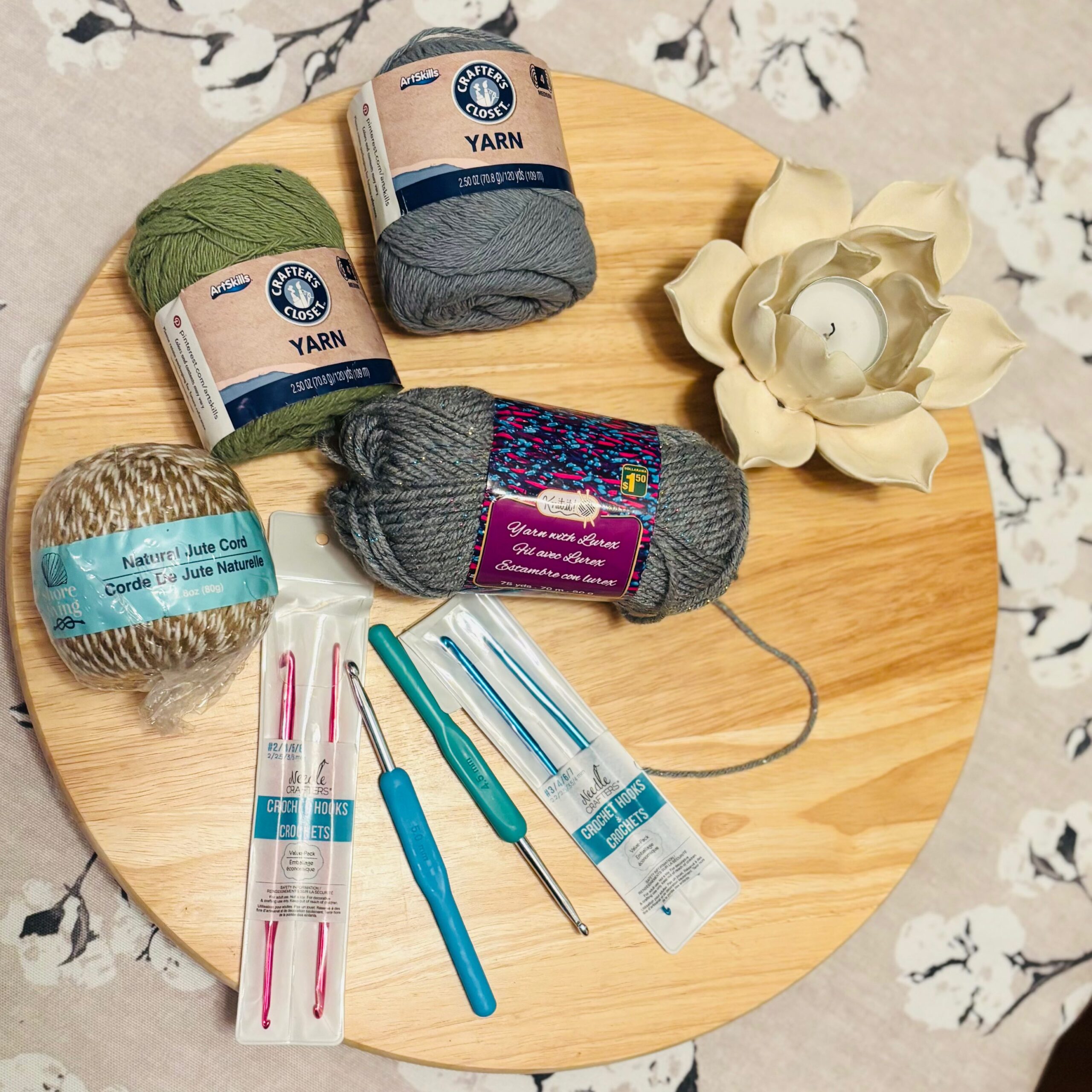 assortment of crochet supplies on a table