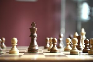 An image of a chess board with chess pieces on it.