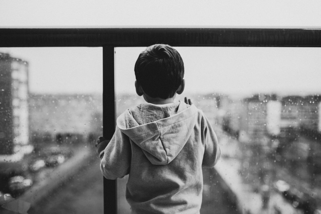 Boy wearing gray hoodie