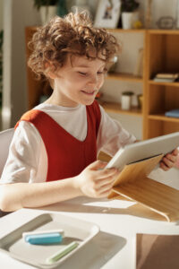 Photo of child using tablet computer