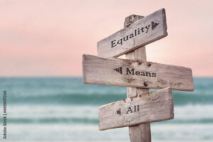 equality means all text quote written on wooden signpost by the sea. Positive pink turqoise pastel theme.