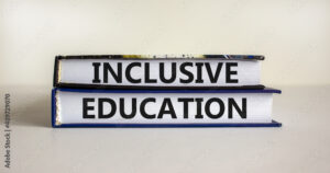 Inclusive education symbol. Books with words 'Inclusive education' on beautiful white background. Business and inclusive education concept. Copy space.