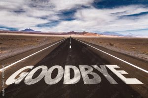 Goodbye written on desert road