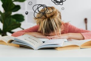 Woman putting her head down on the desk