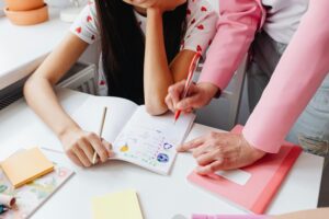 Woman teaching a girl