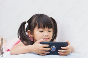 Young girl holding a cell phone