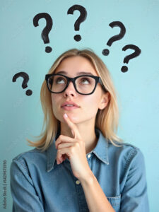Intrigued blonde woman contemplating difficult questions, with a light blue background