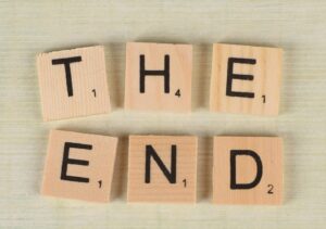Close up of scrabble tiles forming the words the end