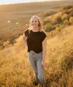 photo of Mackenzie in a field. 