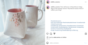 Screenshot of a photo from instragram from Wildfire Ceramics. The photo is of a white mug with pink interior and cherry blossoms on the outside. 