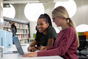 High school students studying together in a library