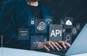 API Application Programming Interface Concept. A programmer types on a laptop, interacting with digital icons representing API development, security, and cloud computing. Application Software Tool,