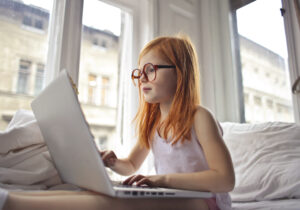 A girl watching movie on computer laptop