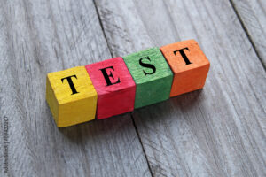 word test on colorful wooden cubes