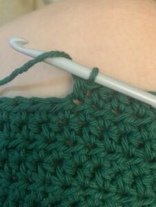 Green crocheting second half of my pot holder