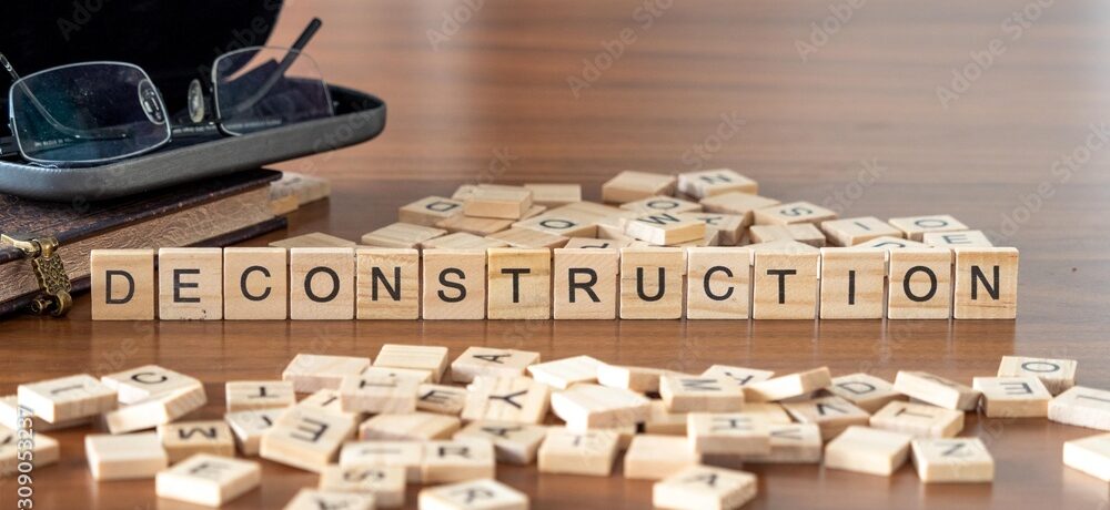 deconstruction the word or concept represented by wooden letter tiles