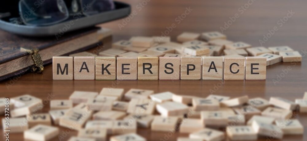 makerspace concept represented by wooden letter tiles