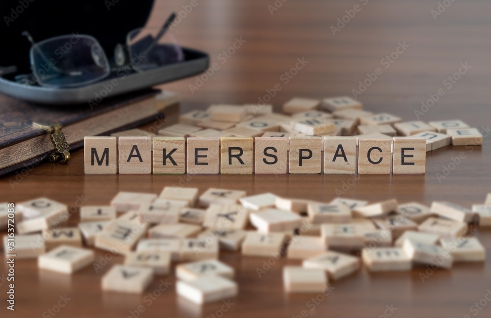 makerspace concept represented by wooden letter tiles