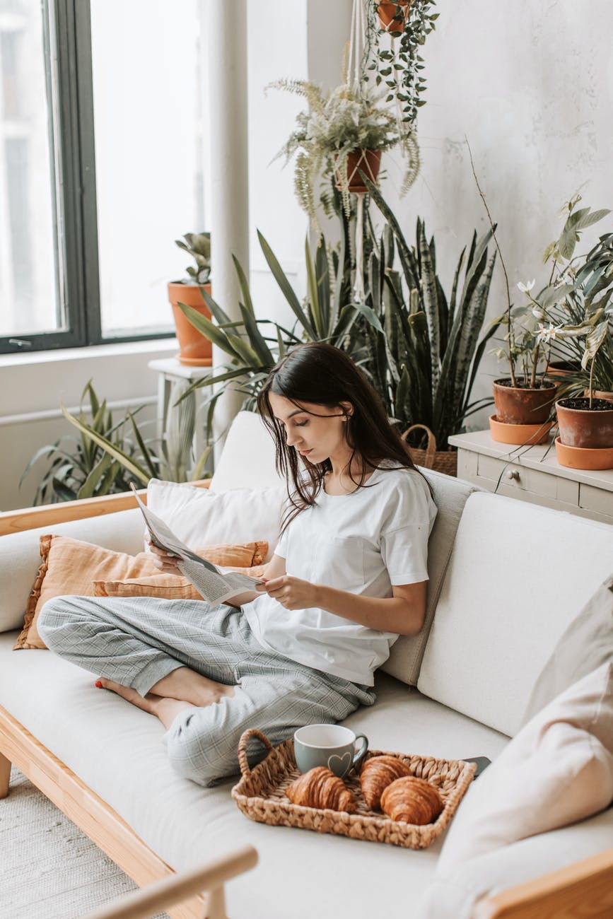 a woman reading the newspaper