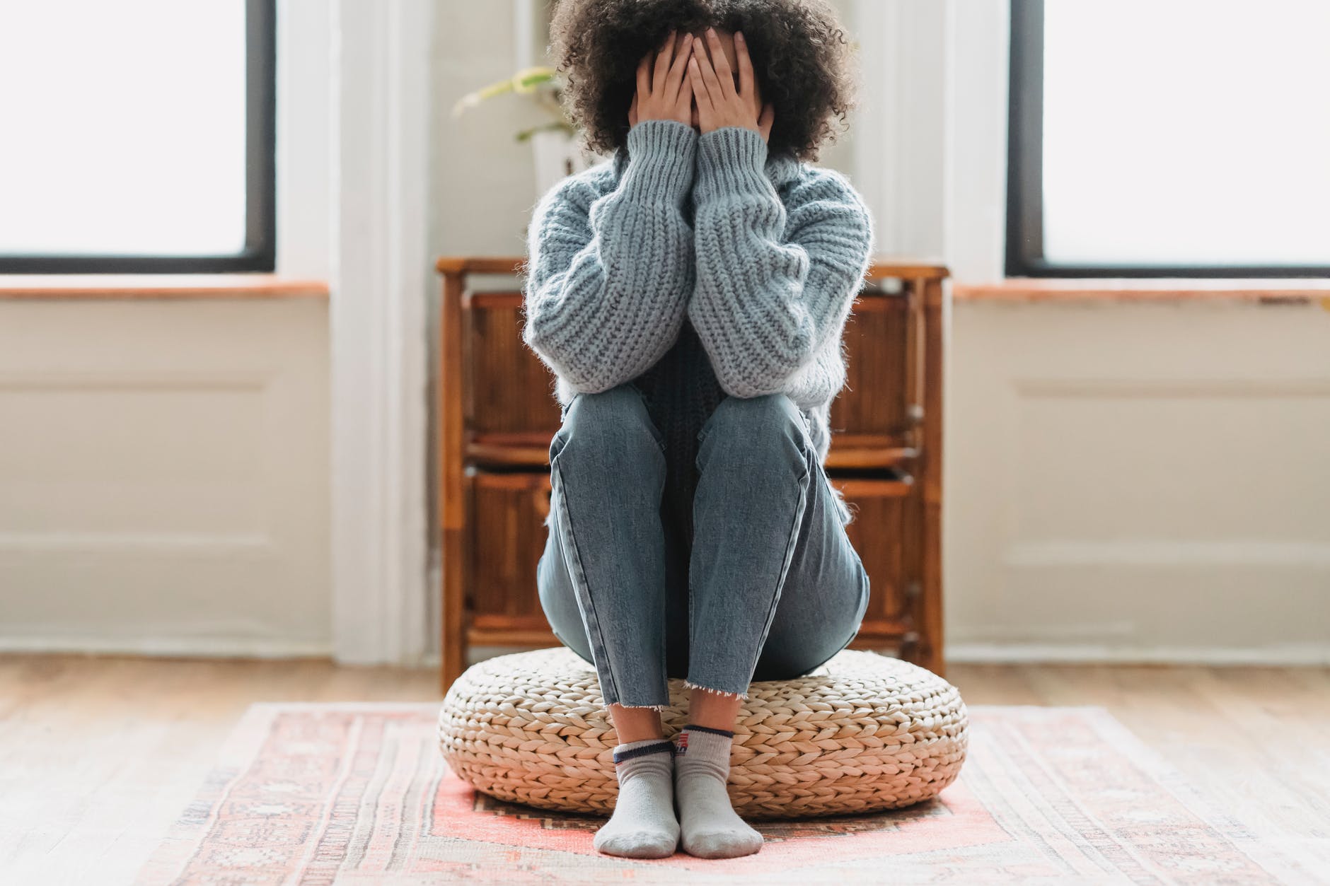 faceless unhappy woman covering face