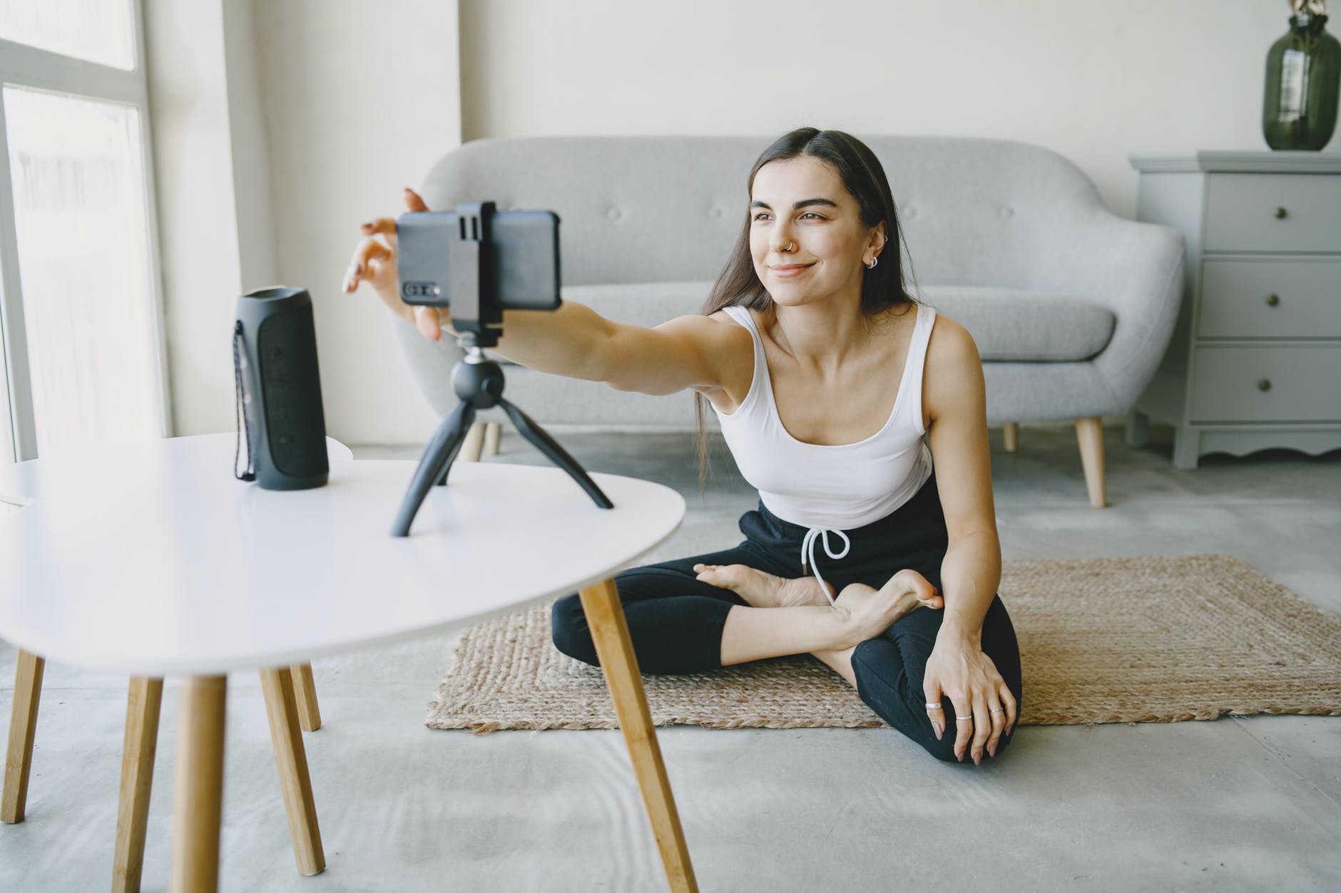 a woman recording herself with her smartphone